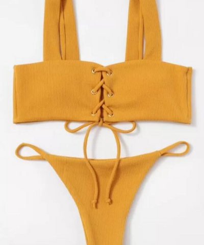 Braguita de bikini con botones en la parte delantera y canalé blanco