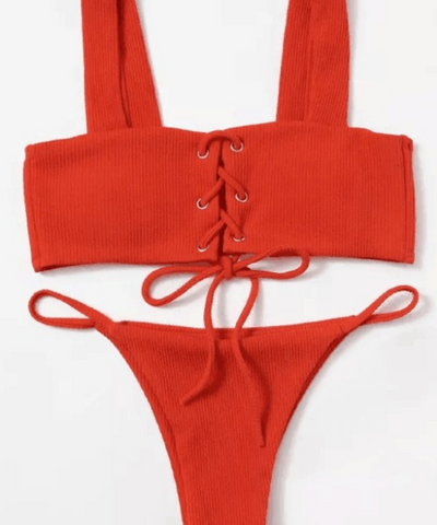 Braguita de bikini con botones en la parte delantera y canalé blanco