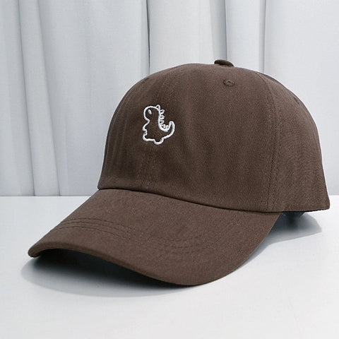 Bonita gorra de béisbol con forma de dinosaurio