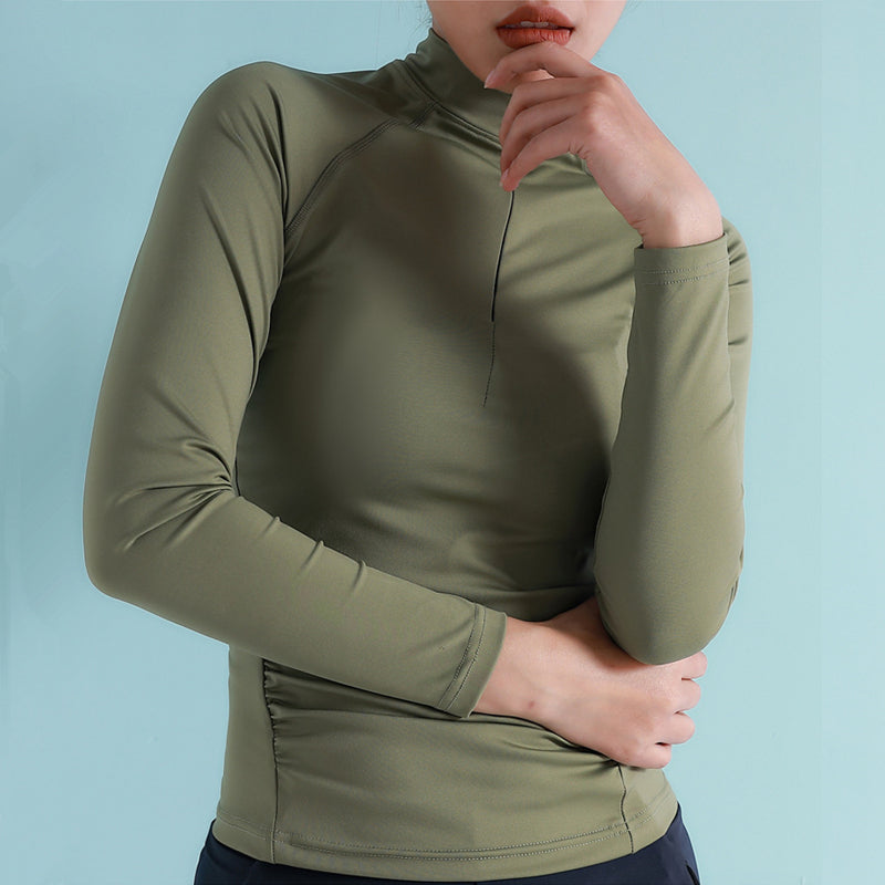 Camisa de yoga y deportes para mujer con mangas largas, cuello con cremallera y orificio para el pulgar