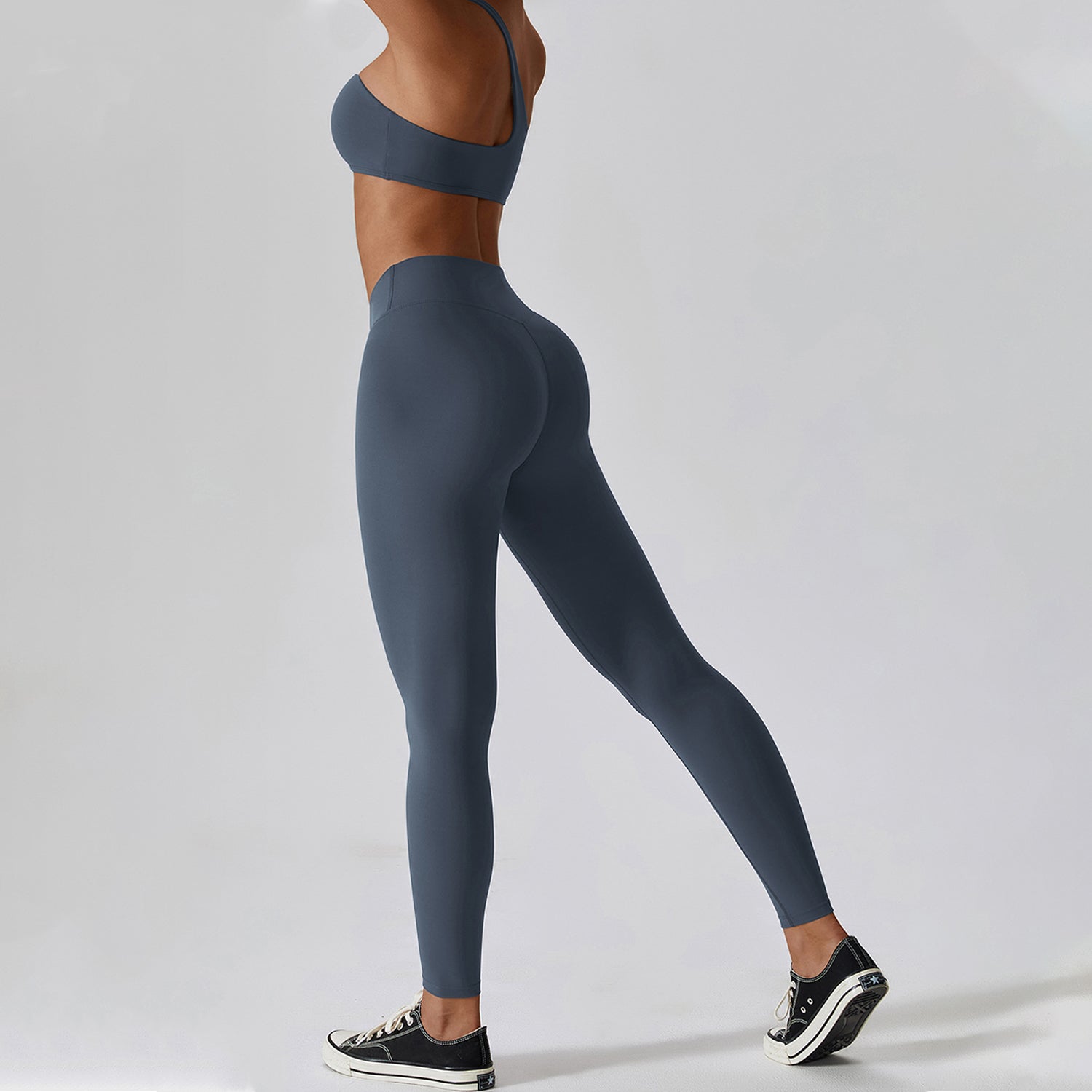 Conjunto de sujetador y leggings de entrenamiento irregulares con un solo hombro