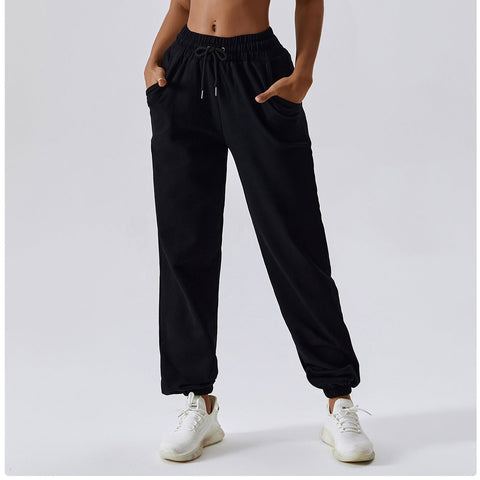 Pantalones deportivos casuales con bolsillos laterales y cordón