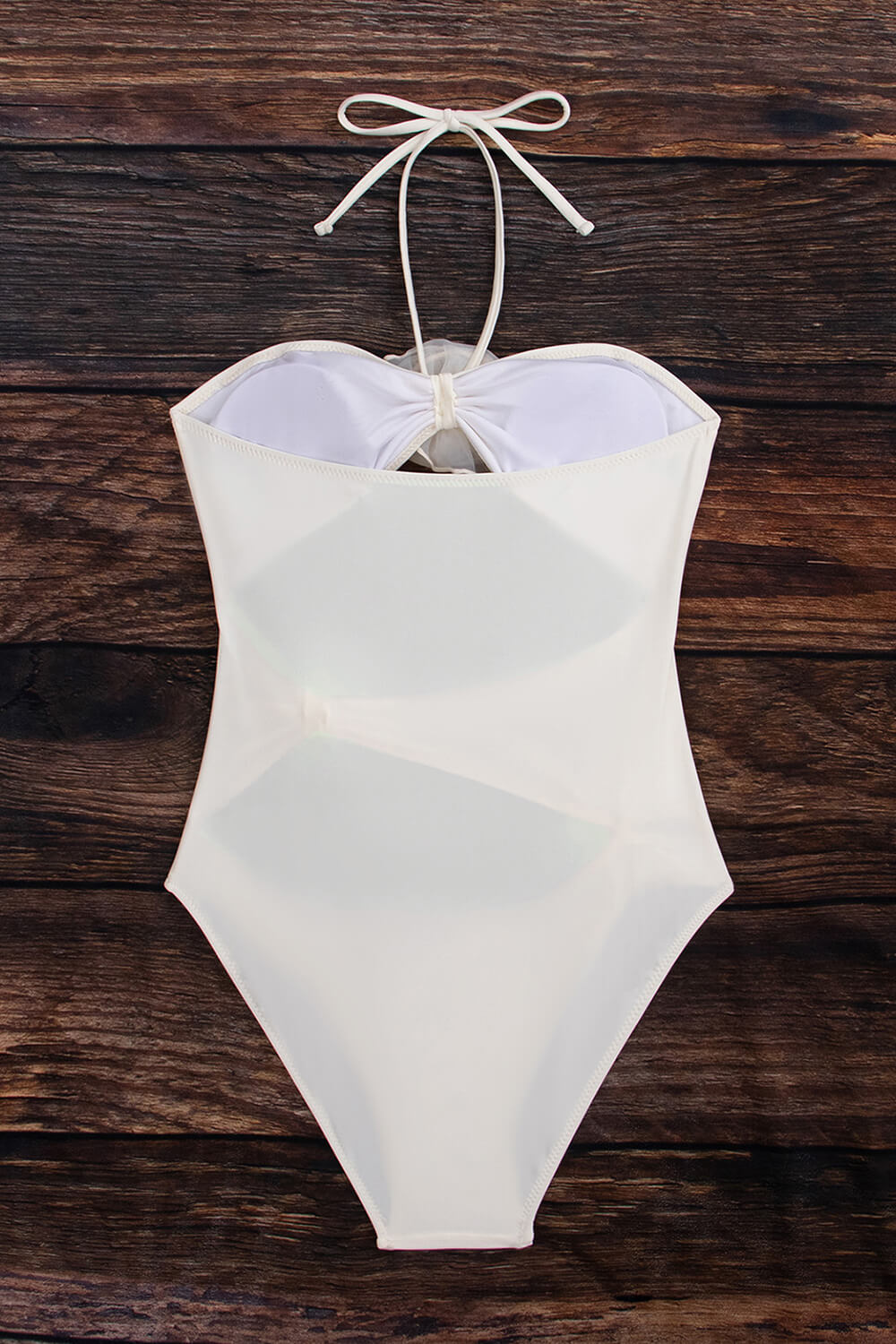 Traje de baño de una pieza sin tirantes con escote pronunciado y apliques de rosas